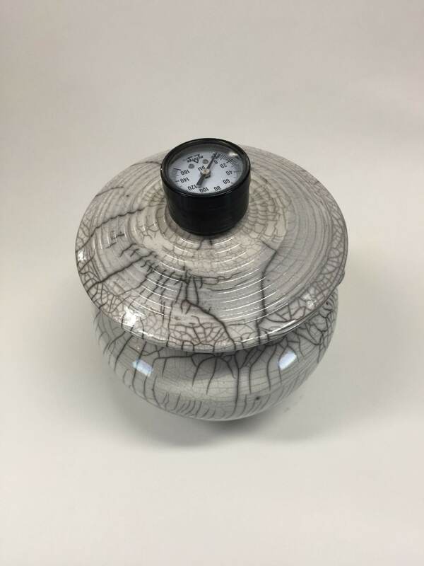 white raku fired pot with lid with pressure gauge for handle
